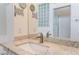 Bathroom vanity with granite countertop, sink, and mirrored cabinets at 10901 Fort Valley Ave, Las Vegas, NV 89134