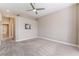 Primary bedroom features carpet floors, ceiling fan, and ensuite bathroom at 10901 Fort Valley Ave, Las Vegas, NV 89134