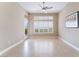Bonus room with ceramic tile flooring, a ceiling fan, and large picture windows at 10901 Fort Valley Ave, Las Vegas, NV 89134