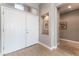 Inviting entryway with double doors, tile flooring, and recessed niche for decor at 10901 Fort Valley Ave, Las Vegas, NV 89134