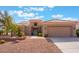 Charming single-story home boasts a desert landscape, neutral colors and tile roof at 10901 Fort Valley Ave, Las Vegas, NV 89134