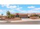 Well-maintained single-Gathering home with a tile roof, desert landscaping, and a three-car garage at 10901 Fort Valley Ave, Las Vegas, NV 89134