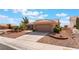 Single-story home featuring a tile roof, desert landscaping, and a three-car garage at 10901 Fort Valley Ave, Las Vegas, NV 89134