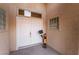 Elegant double front door with decorative accents and traditional hardware at 10901 Fort Valley Ave, Las Vegas, NV 89134