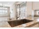 Kitchen island sink with granite countertop, stainless steel appliances, and natural lighting at 10901 Fort Valley Ave, Las Vegas, NV 89134