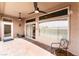 Beautiful covered patio with an outdoor seating area, ceiling fans, and views of the backyard at 10901 Fort Valley Ave, Las Vegas, NV 89134