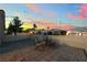 Private patio features tiled flooring, relaxing seating, and is fenced in for cozy outdoor relaxation at 10901 Fort Valley Ave, Las Vegas, NV 89134