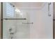 Modern shower featuring glass doors, updated fixtures and tiled walls at 10901 Fort Valley Ave, Las Vegas, NV 89134