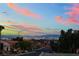 Scenic street view overlooking the Las Vegas skyline at sunset with clear, colorful skies at 10901 Fort Valley Ave, Las Vegas, NV 89134