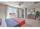 Bright bedroom with a large window, cozy carpet, and a modern ceiling fan at 1220 Eva Creek Dr # 35, North Las Vegas, NV 89084