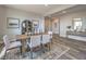 Stylish dining area featuring a rustic wood table and chairs, with modern décor and lighting at 1220 Eva Creek Dr # 35, North Las Vegas, NV 89084