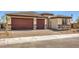 Beautiful single-story home with a two-car garage and a nicely landscaped front yard at 1220 Eva Creek Dr # 35, North Las Vegas, NV 89084
