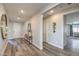 Bright hallway with decorative mirror and console that leads to other rooms of the house at 1220 Eva Creek Dr # 35, North Las Vegas, NV 89084