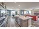 Stylish kitchen featuring a large center island, stainless appliances, and cozy eat-in area at 1220 Eva Creek Dr # 35, North Las Vegas, NV 89084