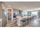 Gourmet kitchen with a large island, modern appliances, and eat-in dining area at 1220 Eva Creek Dr # 35, North Las Vegas, NV 89084