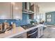 Modern kitchen boasts stainless steel appliances and stylish tile backsplash at 1220 Eva Creek Dr # 35, North Las Vegas, NV 89084