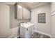 Efficient laundry room with overhead cabinets and side by side washer and dryer at 1220 Eva Creek Dr # 35, North Las Vegas, NV 89084