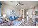 Open living room area features stylish furniture and decor, leading to other rooms in the home at 1220 Eva Creek Dr # 35, North Las Vegas, NV 89084