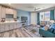Comfortable living room boasting a kitchenette, modern furniture, and plenty of natural light at 1220 Eva Creek Dr # 35, North Las Vegas, NV 89084