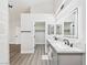 Bathroom featuring a double vanity, modern fixtures, and access to a walk-in closet at 1305 Pagentry Dr, North Las Vegas, NV 89031