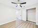 Bedroom featuring a ceiling fan, closet with sliding doors, and bright, neutral decor at 1305 Pagentry Dr, North Las Vegas, NV 89031