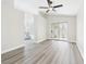 A bedroom with a ceiling fan, sliding doors and entry to the bathroom at 1305 Pagentry Dr, North Las Vegas, NV 89031