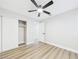 This bedroom features a closet, a ceiling fan, and neutral walls and flooring at 1305 Pagentry Dr, North Las Vegas, NV 89031