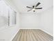 Bedroom featuring a modern ceiling fan and a large window at 1305 Pagentry Dr, North Las Vegas, NV 89031