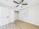 Light-filled bedroom with ceiling fan, closet, and modern flooring at 1305 Pagentry Dr, North Las Vegas, NV 89031