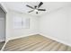 Bedroom featuring a ceiling fan, neutral paint, and natural light through the window at 1305 Pagentry Dr, North Las Vegas, NV 89031