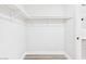 Walk-in closet with white shelving and ample storage space at 1305 Pagentry Dr, North Las Vegas, NV 89031