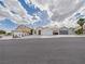 A charming single-story home with a two-car garage and desert landscaping at 1305 Pagentry Dr, North Las Vegas, NV 89031
