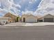 Charming single-story home featuring a low-maintenance front yard and a two-car garage, providing a welcoming curb appeal at 1305 Pagentry Dr, North Las Vegas, NV 89031