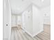 Bright hallway with streamlined doors and continuous modern flooring at 1305 Pagentry Dr, North Las Vegas, NV 89031