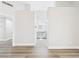 An open hallway with a view into the bathroom at 1305 Pagentry Dr, North Las Vegas, NV 89031