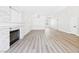 Bright and spacious living room with laminate floors and a cozy fireplace at 1305 Pagentry Dr, North Las Vegas, NV 89031