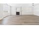 Bright living room with laminate floors and a charming stone fireplace at 1305 Pagentry Dr, North Las Vegas, NV 89031