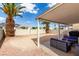 Landscaped backyard featuring a covered patio and mountain views, perfect for outdoor enjoyment at 1360 Angel Falls St, Las Vegas, NV 89142
