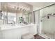 Ensuite bathroom with a double sink vanity and step-in shower at 1360 Angel Falls St, Las Vegas, NV 89142