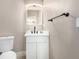 Cozy bathroom with a vanity, black hardware, and neutral walls at 1360 Angel Falls St, Las Vegas, NV 89142