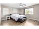 Comfortable bedroom with a ceiling fan, natural light, and wooden floors at 1360 Angel Falls St, Las Vegas, NV 89142