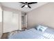 Comfortable bedroom featuring ceiling fan, closet, and a twin bed with decorative pillows and wood floor at 1360 Angel Falls St, Las Vegas, NV 89142
