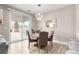 Dining area features contemporary lighting fixture and access to the backyard through a sliding glass door at 1360 Angel Falls St, Las Vegas, NV 89142