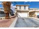 Charming two-story home features a two-car garage and low-maintenance desert landscaping at 1360 Angel Falls St, Las Vegas, NV 89142