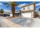 Charming two-story home features a two-car garage, desert landscaping, and long driveway at 1360 Angel Falls St, Las Vegas, NV 89142