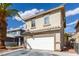 Charming two-story home features a two-car garage, tile roof, and side yard access at 1360 Angel Falls St, Las Vegas, NV 89142