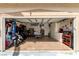 Spacious garage with various tools, motorcycle, fitness equipment, and storage at 1360 Angel Falls St, Las Vegas, NV 89142