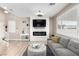 Beautiful living room with wood floors, neutral paint, electric fireplace, and lots of light at 1360 Angel Falls St, Las Vegas, NV 89142
