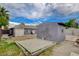 The backyard reveals a practical layout with a gray storage shed with a surrounding area for gardening or recreation at 1414 S 13Th St, Las Vegas, NV 89104