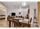 Open-concept dining room leading to the living room and a bedroom; neutral tones and modern lighting at 1414 S 13Th St, Las Vegas, NV 89104